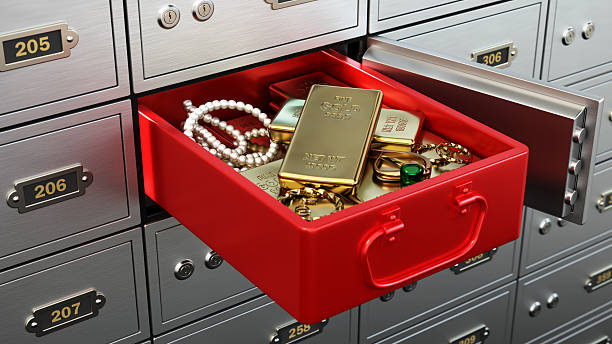 A red container lies inside a safe deposit box at a bank, filled with gold bars, sparkling jewelry, and pearls, showcasing wealth and security in a financial setting. 3D illustration